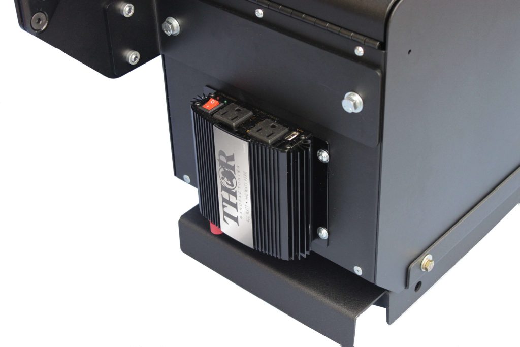 Close-up of a black THOR electronic component mounted on a metal frame, secured with bolts.